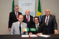 DBS representative signing agreement with ESPM, Brazil, witnessed by Michael D. Higgins, President of Ireland